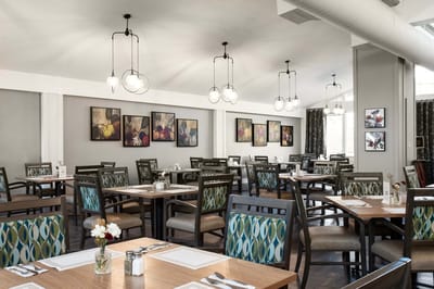 Elegant dining room setup with framed artwork