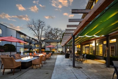 Outdoor patio area with seating and fire pit