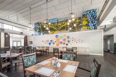 Bright dining room with tables and colorful decor
