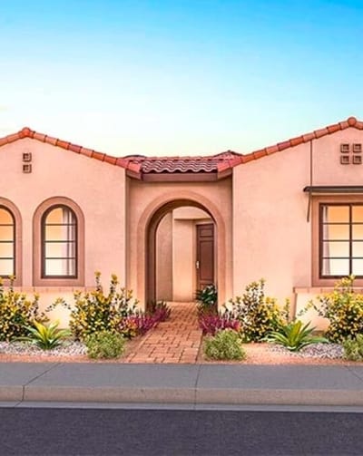 The exterior of a senior living facility with landscaping.