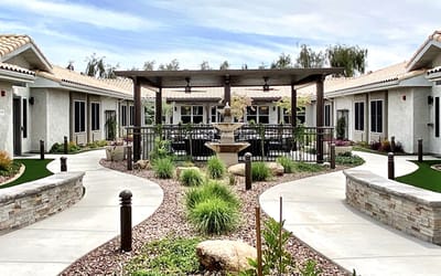 Outdoor courtyard with seating and landscaping.
