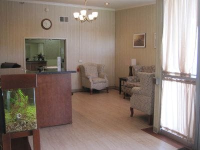 Common area with chairs and fish tank.