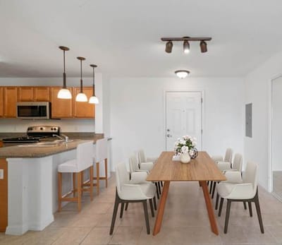 Modern dining area with a large table and chairs