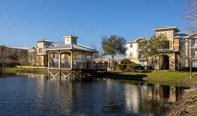 Gazebo by a pond at Village Park Senior Apartments