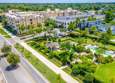 Aerial view of Village Park Senior Apartments and gardens.