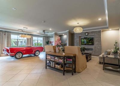 Welcoming common area with vintage car decoration.