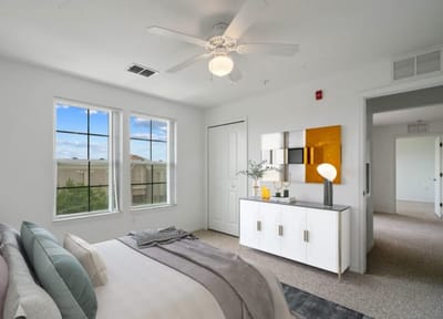 Bright, modern bedroom with a scenic view