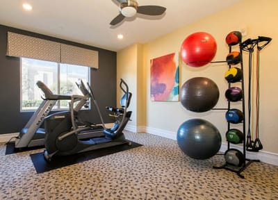 Interior view of a fitness room with exercise equipment.