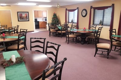 Bright dining room with festive decor and tables set up