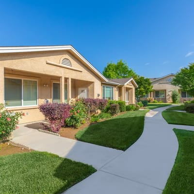 Pathway leading to senior apartment units with gardens