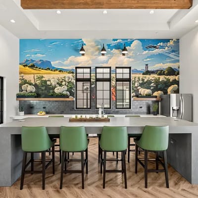 Stylish kitchen area with a mural and seating