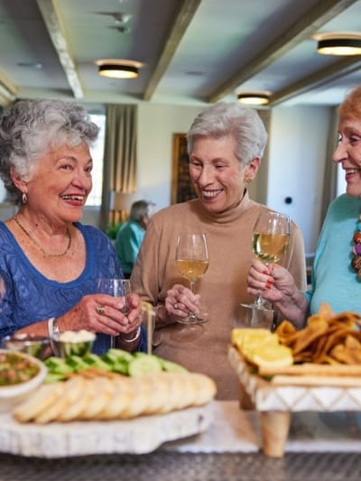 Residents enjoying a social gathering with food and drinks