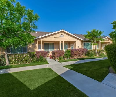 Exterior view of the Arbor Faire Senior Apartments buildings and landscaping