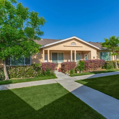 Exterior view of senior apartments with landscaped gardens
