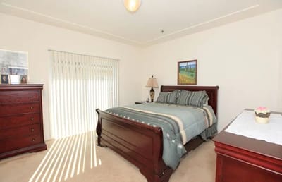 A cozy bedroom in a senior living apartment