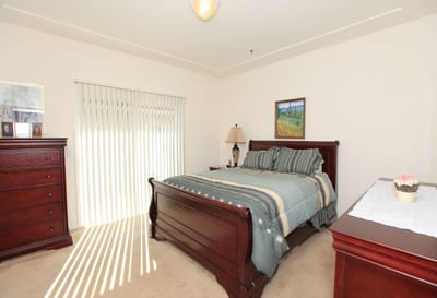 Cozy bedroom with a wooden bed and decor