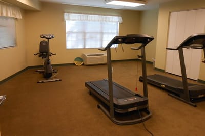 Interior view of a fitness room with exercise equipment