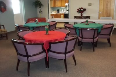 Common area with holiday-themed tables and chairs