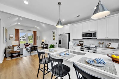 Bright common area with kitchen and seating