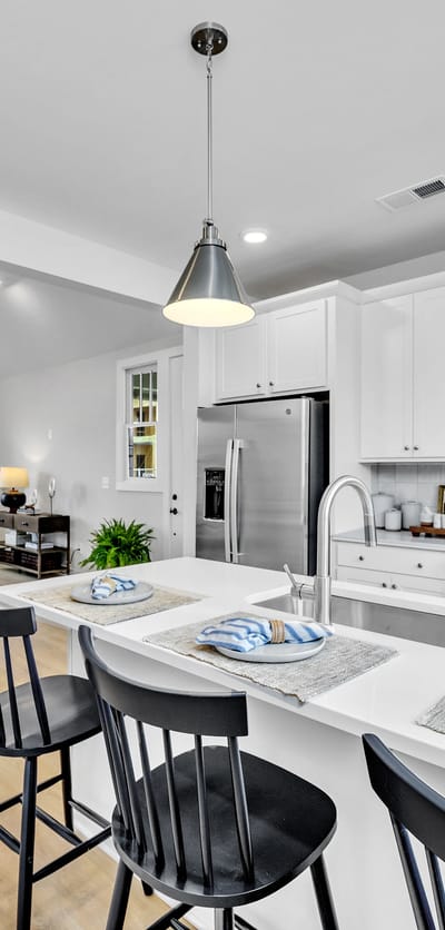 A modern kitchen interior with bar seating