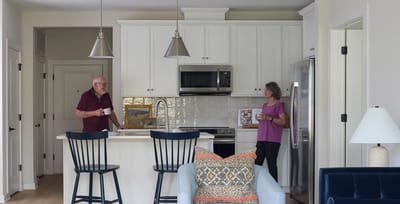 Two residents enjoying coffee in a kitchen