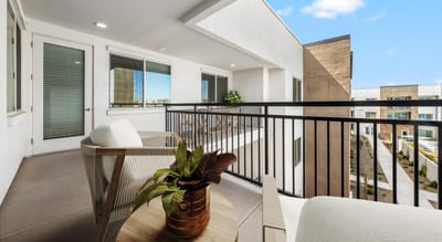 Modern meeting space with a balcony overlooking gardens
