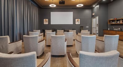 Modern movie theater-style seating in a common area