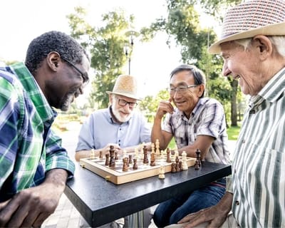 Residents enjoying a game of chess in the garden