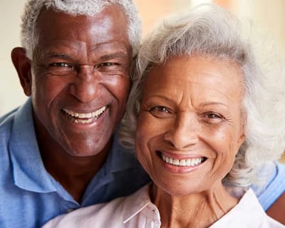A joyful elderly couple smiling together