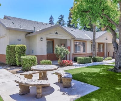 Exterior view of Brookside Senior Apartments with landscaping
