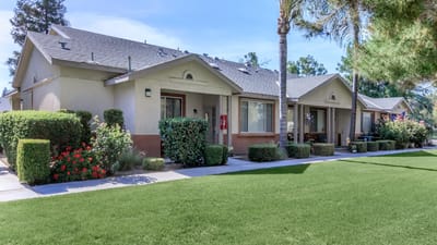 Exterior view of Brookside Senior Apartments with landscaped garden