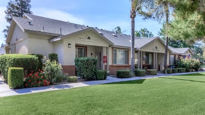 Exterior view of senior apartments with landscaping