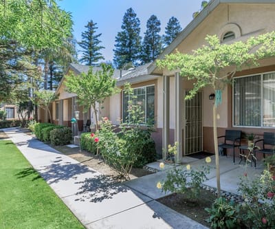Beautifully landscaped pathway lined with senior apartments