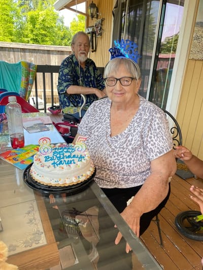 Resident celebrating 85th birthday with cake