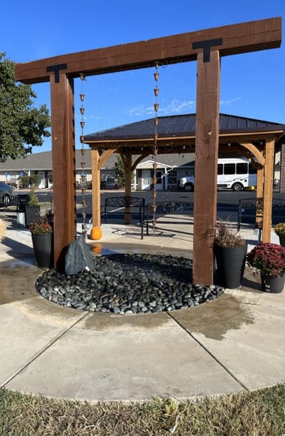 Outdoor water feature with benches and landscaping