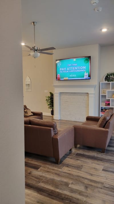 Cozy common area with comfortable seating and a TV