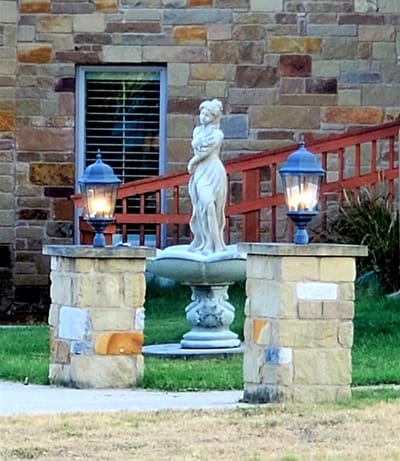 Outdoor fountain and landscaped area at Starwood Manor