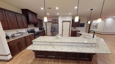 Interior view of a kitchen with granite countertops