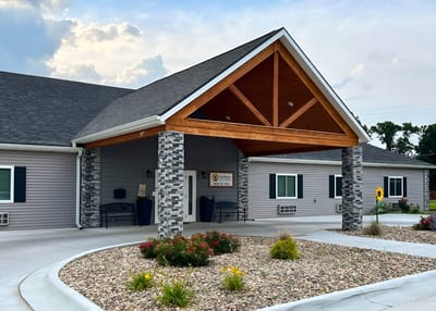 Exterior view of Sunflower Care Homes with entrance