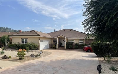 Exterior view of a residential facility with a landscaped yard