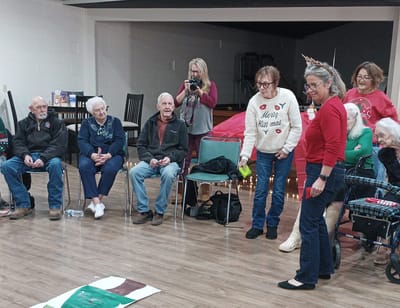 Residents engaged in a festive group activity