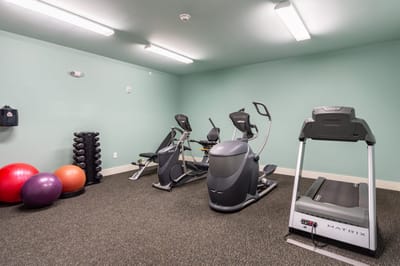 Fitness area with exercise equipment and weights