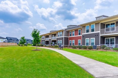 Exterior view of the assisted living facility with landscaped grounds