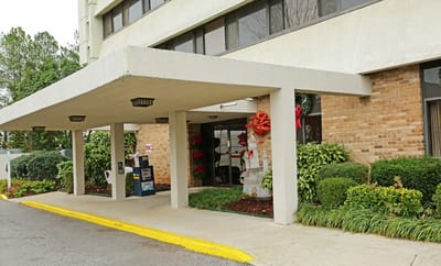 Exterior view of the facility entrance decorated for the holidays