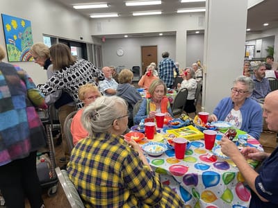 Residents enjoying a social gathering with food