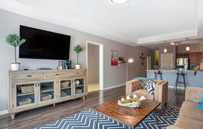 A cozy living room with modern decor and amenities