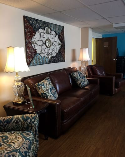 Cozy common area with sofas and decorative art