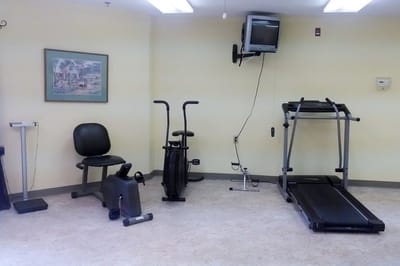 Interior view of a fitness room with exercise equipment