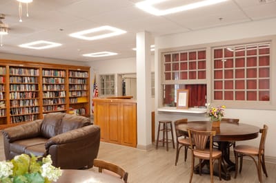 Interior view of a cozy library area with bookshelves