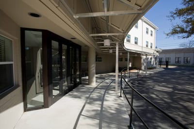 Exterior view of the facility entrance and pathway